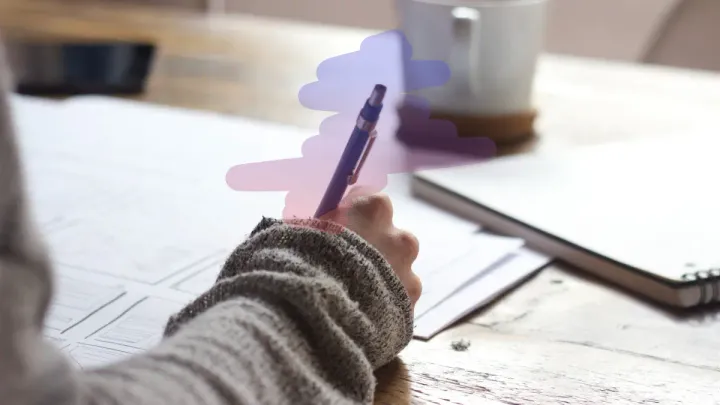 woman writing with pen and gradient colors surround pen